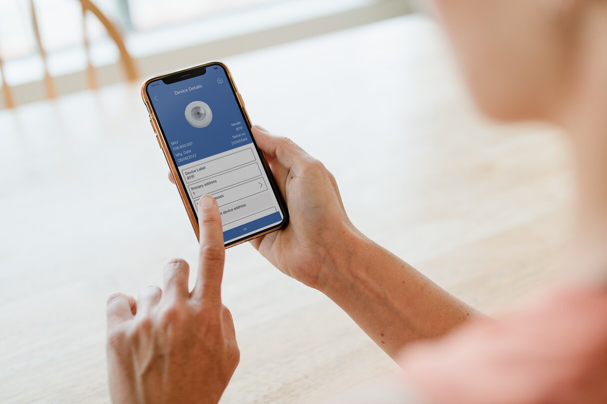 Close-up of a person scrolling through an application on a mobile